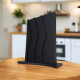 Porte-capsules Nespresso ondulé rempli de capsules, gros plan sur la surface texturée