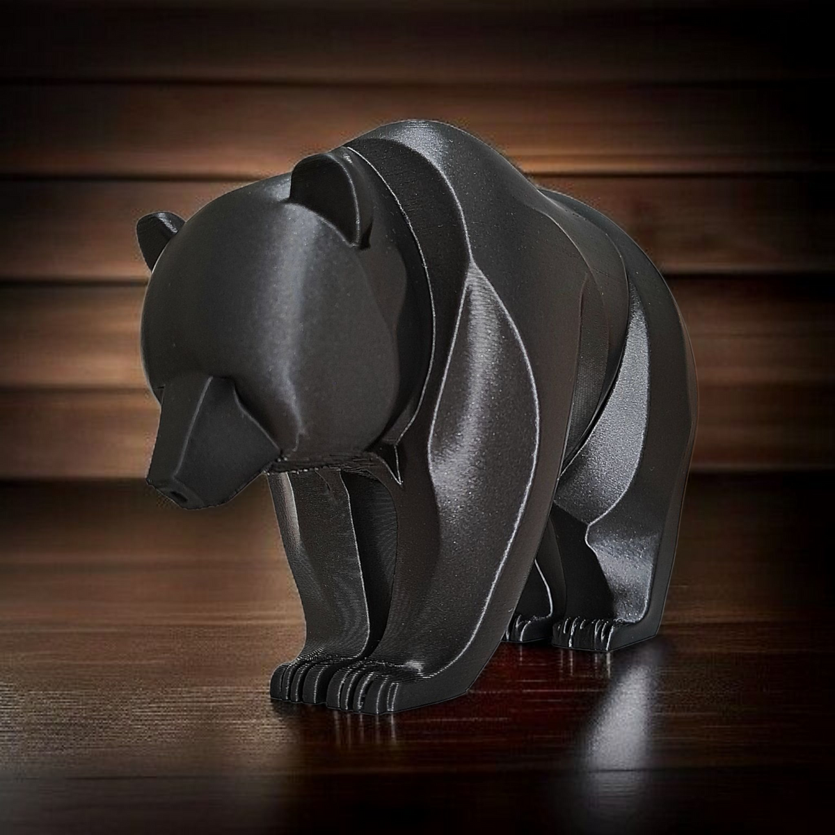 Gros plan d'une sculpture d'ours minimaliste aux lignes courbes et à la surface lisse