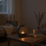 Photophore LED moderne sur une étagère avec une lumière chaude à l'intérieur