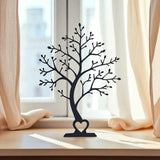 Arbre décoratif minimaliste en silhouette, vu de face, aux lignes de branches épurées
