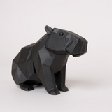 Gros plan de la surface du capybara low poly aux facettes qui captent la lumière