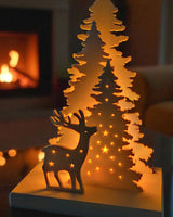 Décoration de Noël avec cerf et sapin, vue de dos avec emplacement pour bougie chauffe-plat