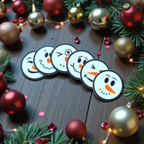 Six sous-verres bonshommes de neige aux visages différents dans leur support assorti