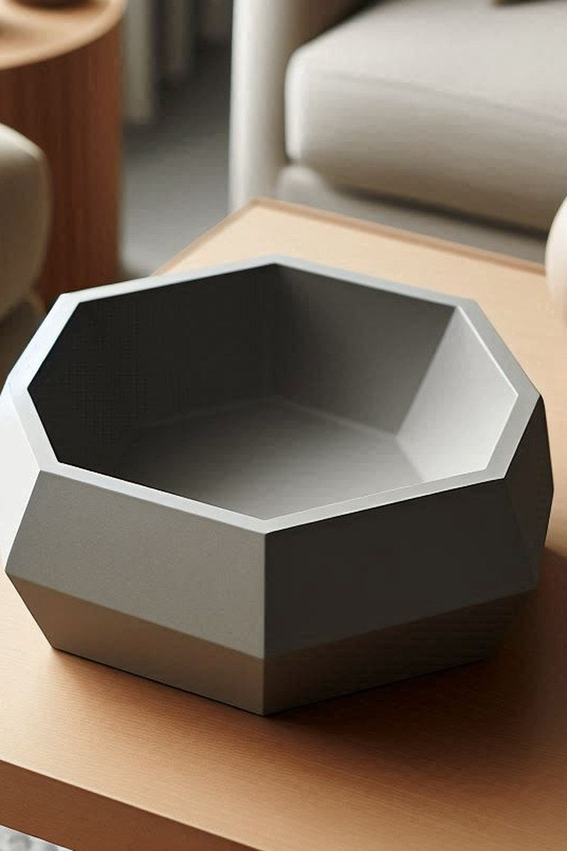 Gros plan d'une coupe minimaliste aux formes douces et arrondies et à la surface mate