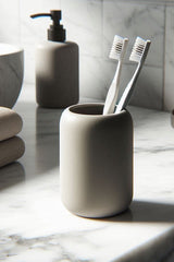 Porte-brosse à dents blanc arrondi avec brosse à dents et tube de dentifrice