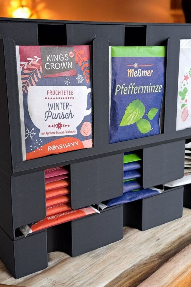 Gros plan d'un organiseur à thé moderne aux lignes épurées avec sachets de thé