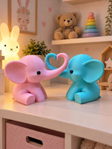 Couple d'éléphants bleu clair et rose aux trompes formant un cœur dans une chambre d'enfant