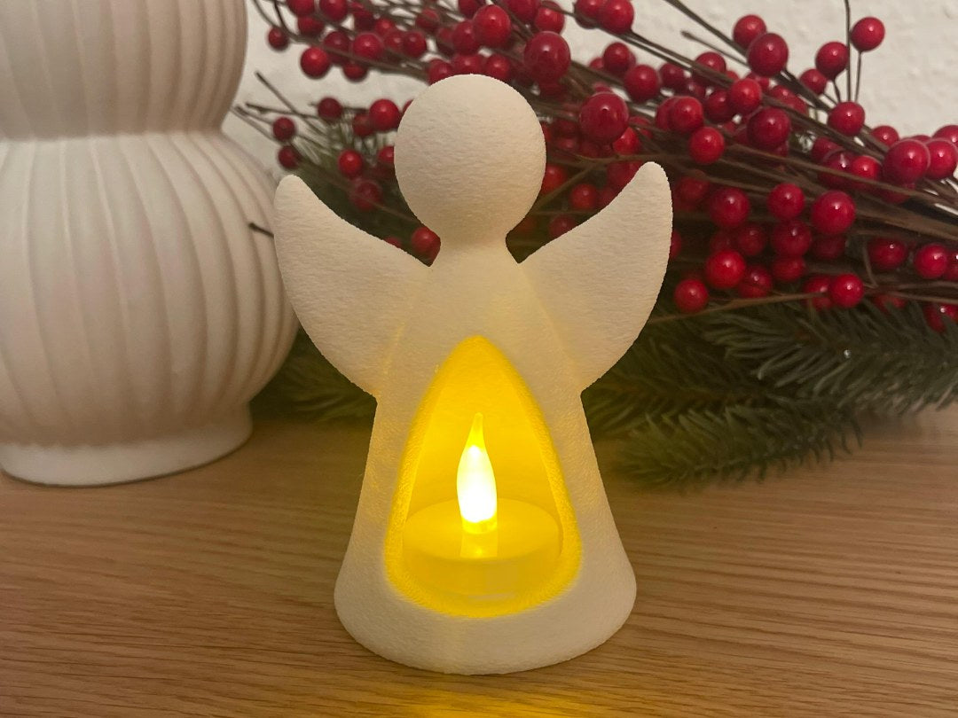 Figurine d'ange avec bougie LED qui l'éclaire de l'intérieur
