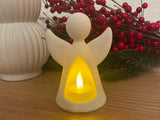 Figurine d'ange avec bougie LED qui l'éclaire de l'intérieur