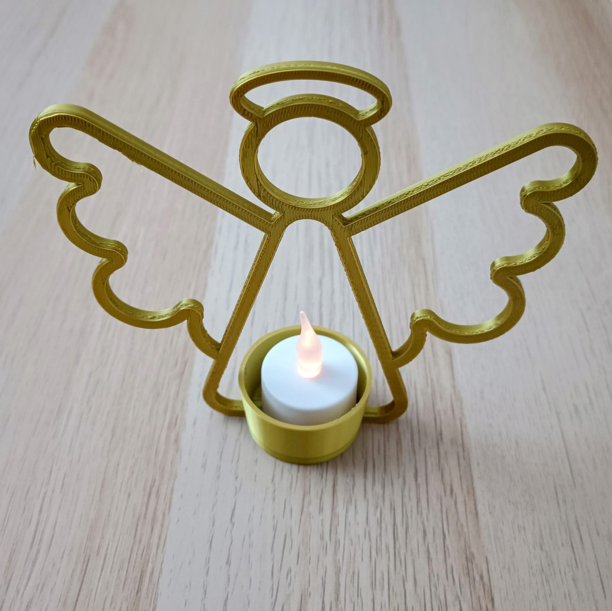 Photophore ange avec bougie LED au centre
