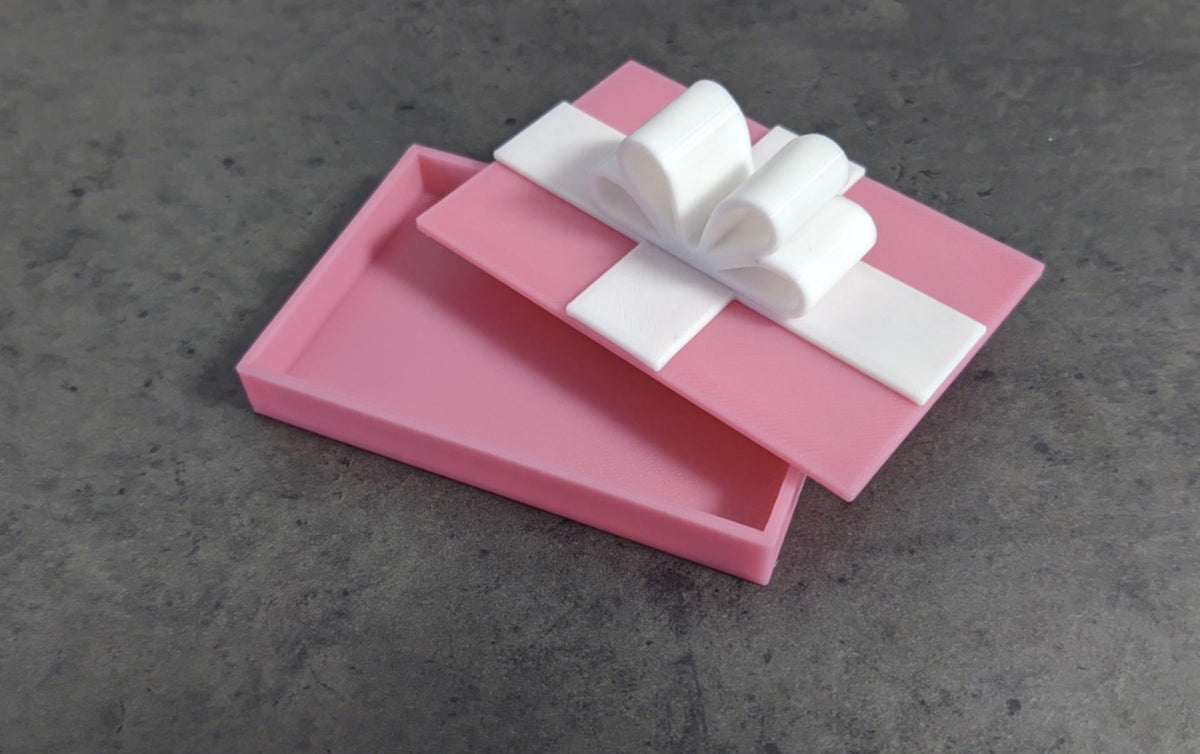 Petite boîte pour carte cadeau avec couvercle en forme de nœud