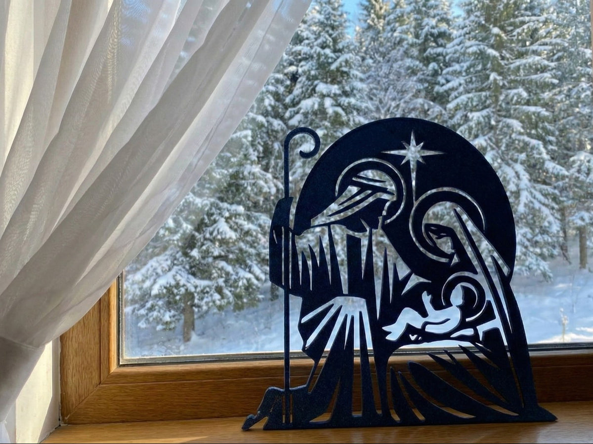 Crèche en silhouette avec Joseph, Marie, l'Enfant Jésus et l'étoile