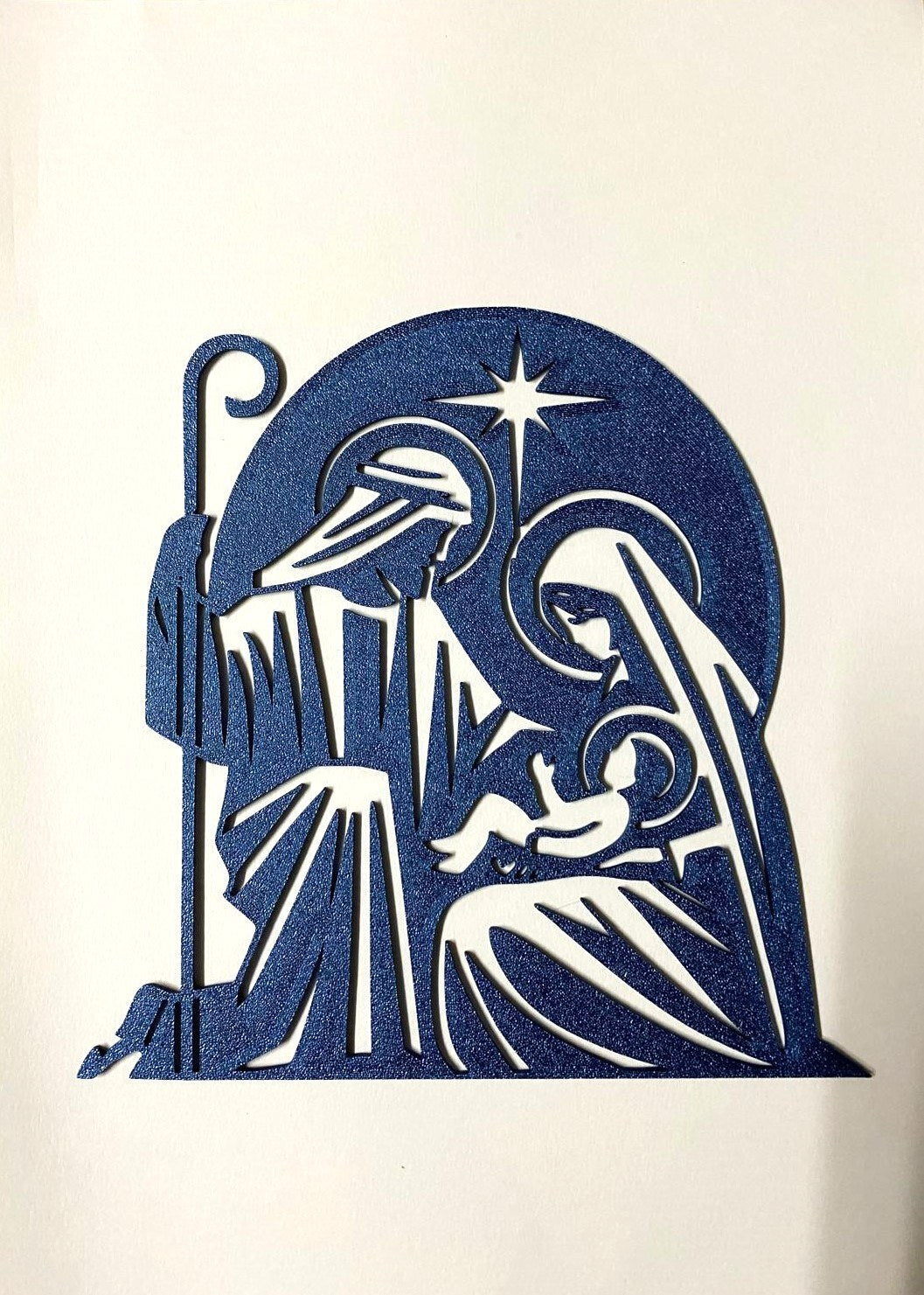 Crèche en silhouette avec Joseph, Marie, l'Enfant Jésus et l'étoile