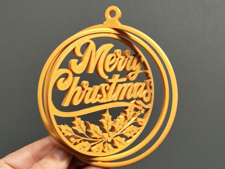 Boule de Noël gyroscopique avec l'inscription Merry Christmas