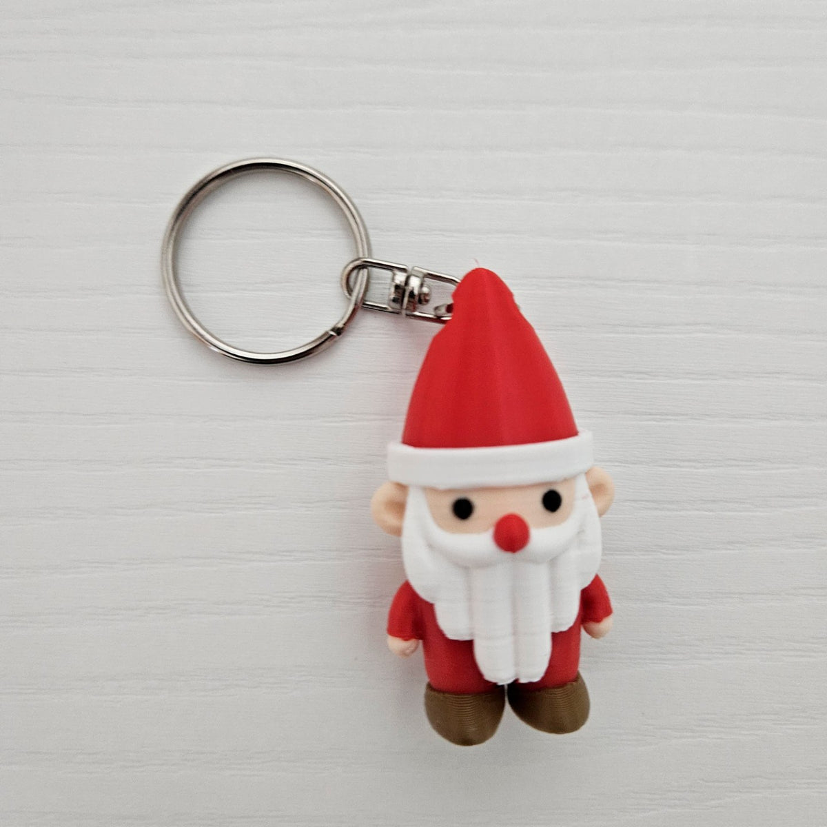 Joli Père Noël en porte-clés avec trou dans le bonnet