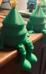 Petite figurine de sapin vert avec étoile jaune