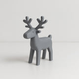Figurine de renne minimaliste aux lignes épurées