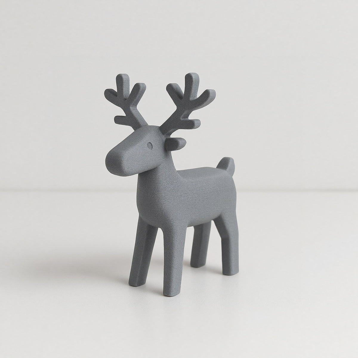 Figurine de renne minimaliste aux lignes épurées