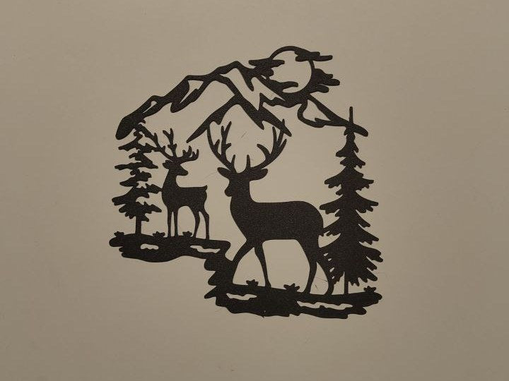 Décoration murale avec renne devant des montagnes