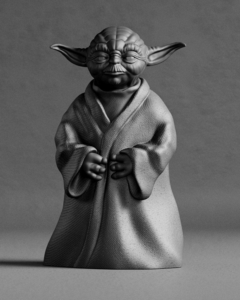 Gros plan d'une sculpture détaillée de Maître Yoda aux plis de cape ondulants et à l'expression sereine