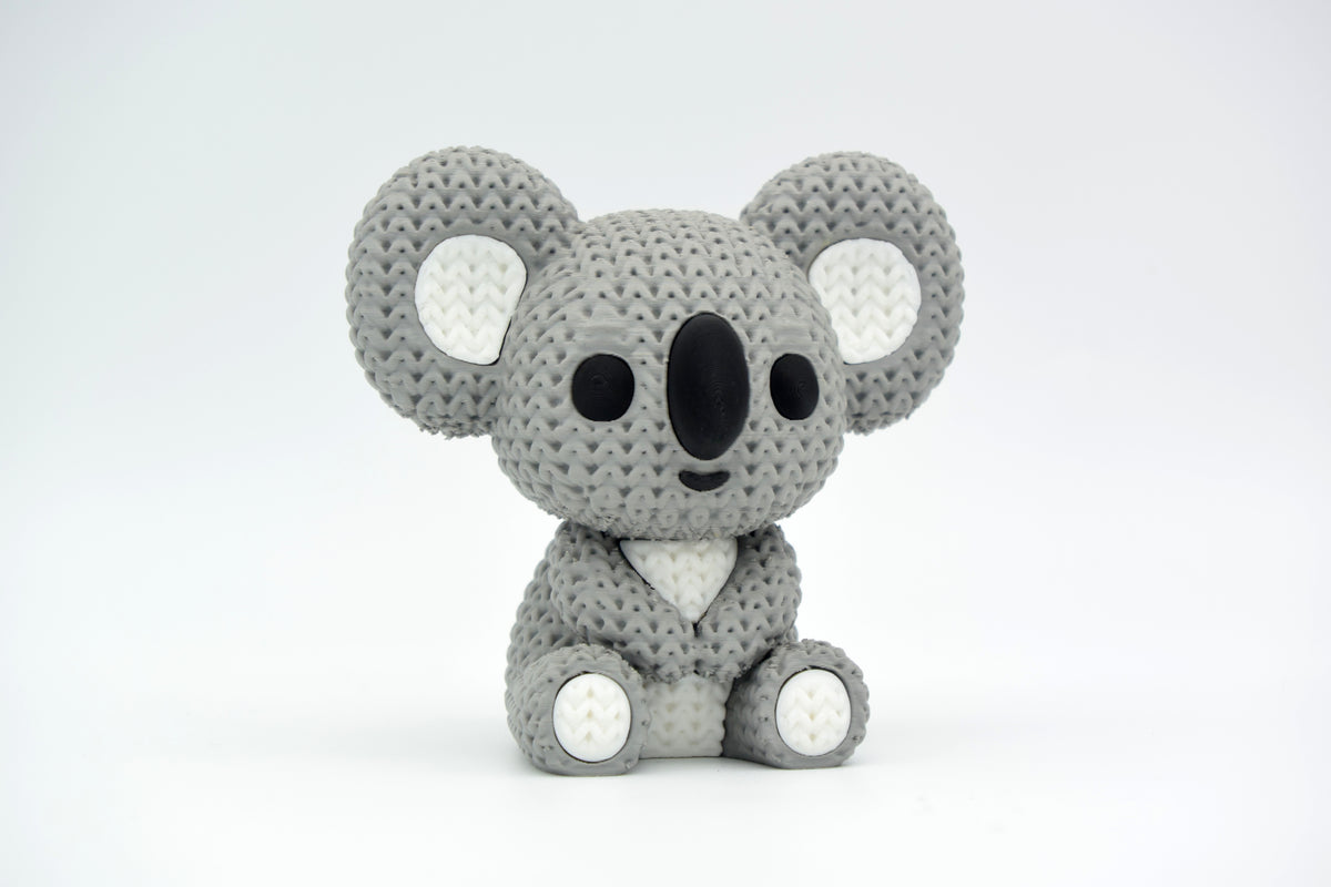 Détail de texture d'un koala façon tricot avec motif de boucles façon laine sur le dos et les membres