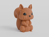 Gros plan d'une figurine d'écureuil tricoté, aspect crocheté et petits yeux de verre