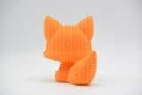 Détail de texture d'une figurine renard façon tricot avec doux motif de boucles crochetées