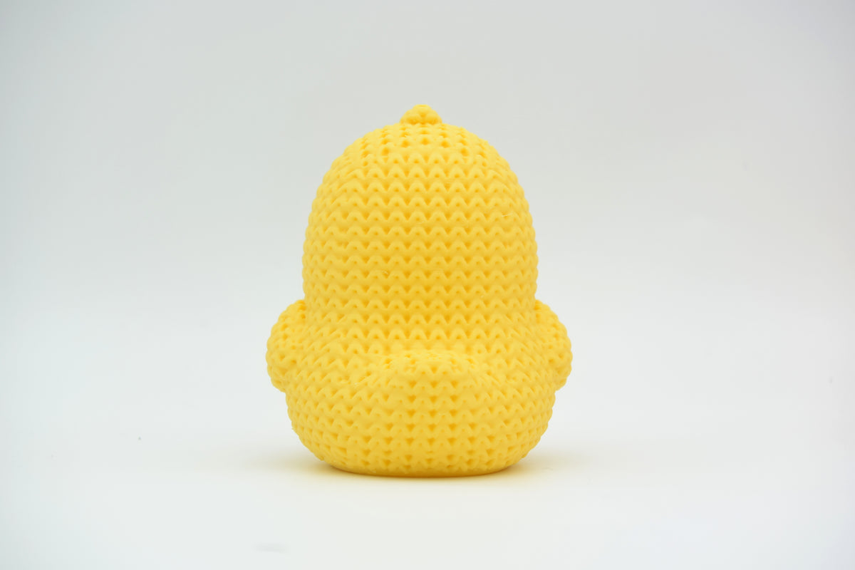 Détail de texture d'un poussin façon tricot avec doux motif crocheté strié en jaune