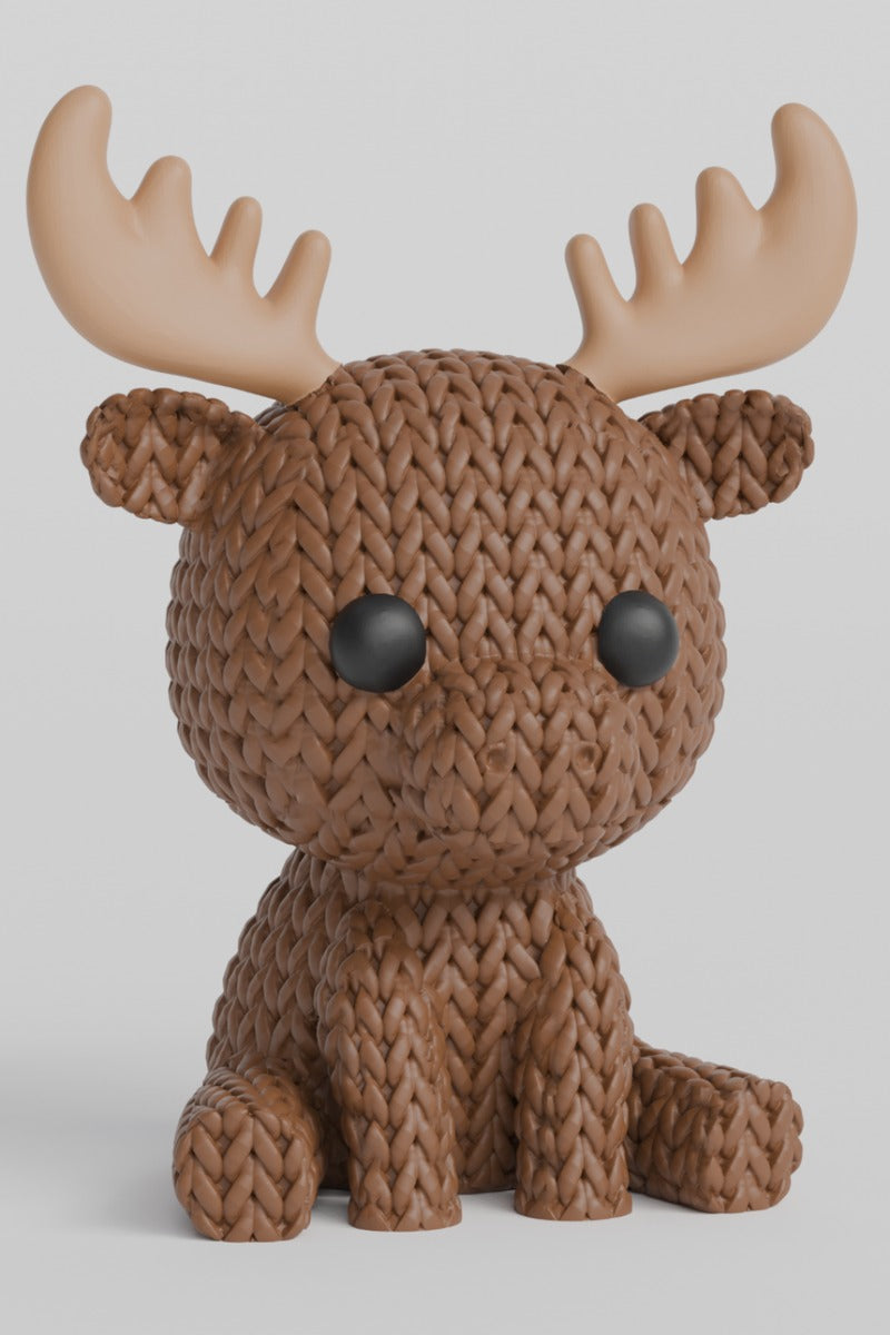 Gros plan d'un élan tricoté, aspect crocheté et bois détaillés