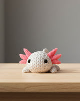 Détail de texture d'un axolotl façon tricot avec motif de boucles crochetées et branchies sculptées