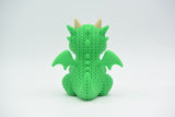 Gros plan du motif à boucles crocheté d'un dragon tricoté