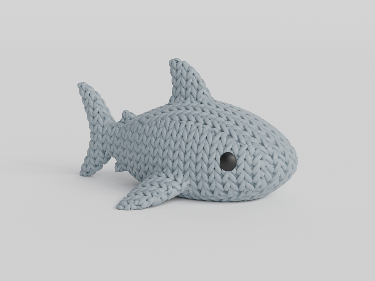 Détail de texture du requin façon tricot au motif de boucles crochetées sur tout le corps
