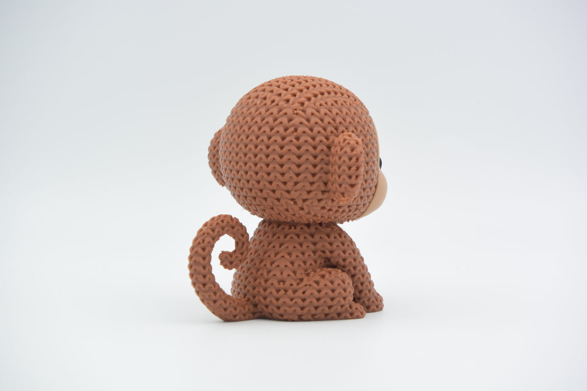 Détail de texture du singe façon tricot au motif crocheté tissé