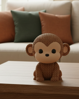 Gros plan d'une figurine de singe tricoté, aspect crocheté détaillé, sur surface claire