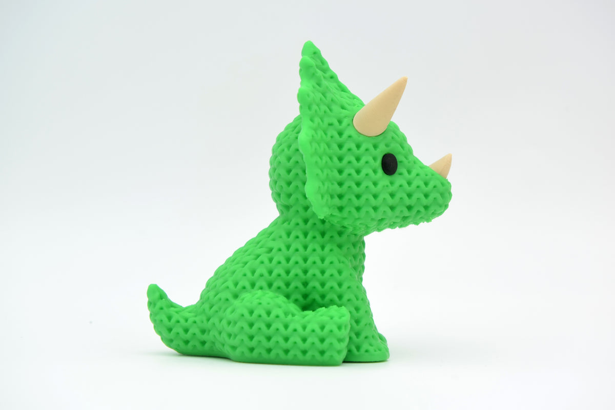Détail de texture de la surface crochetée d'une figurine tricératops
