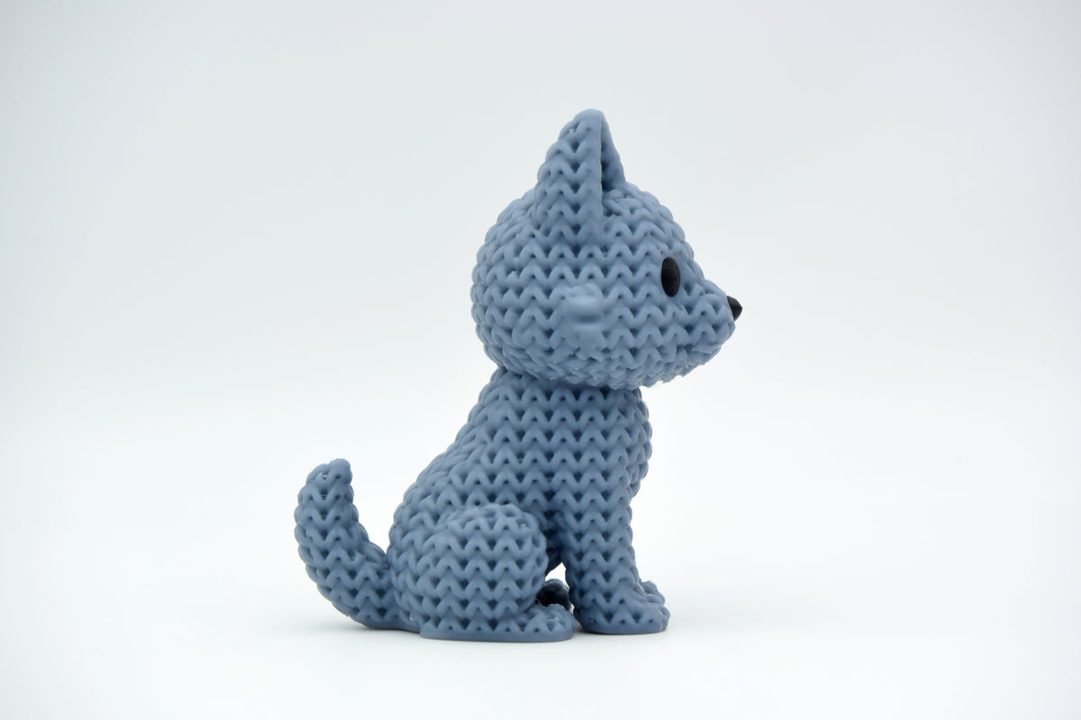Détail de texture d'une figurine loup façon tricot avec doux motif de boucles sur le dos et les oreilles