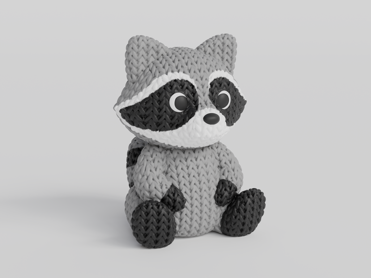 Gros plan d'une figurine de raton laveur tricoté, aspect crocheté détaillé, sur fond blanc