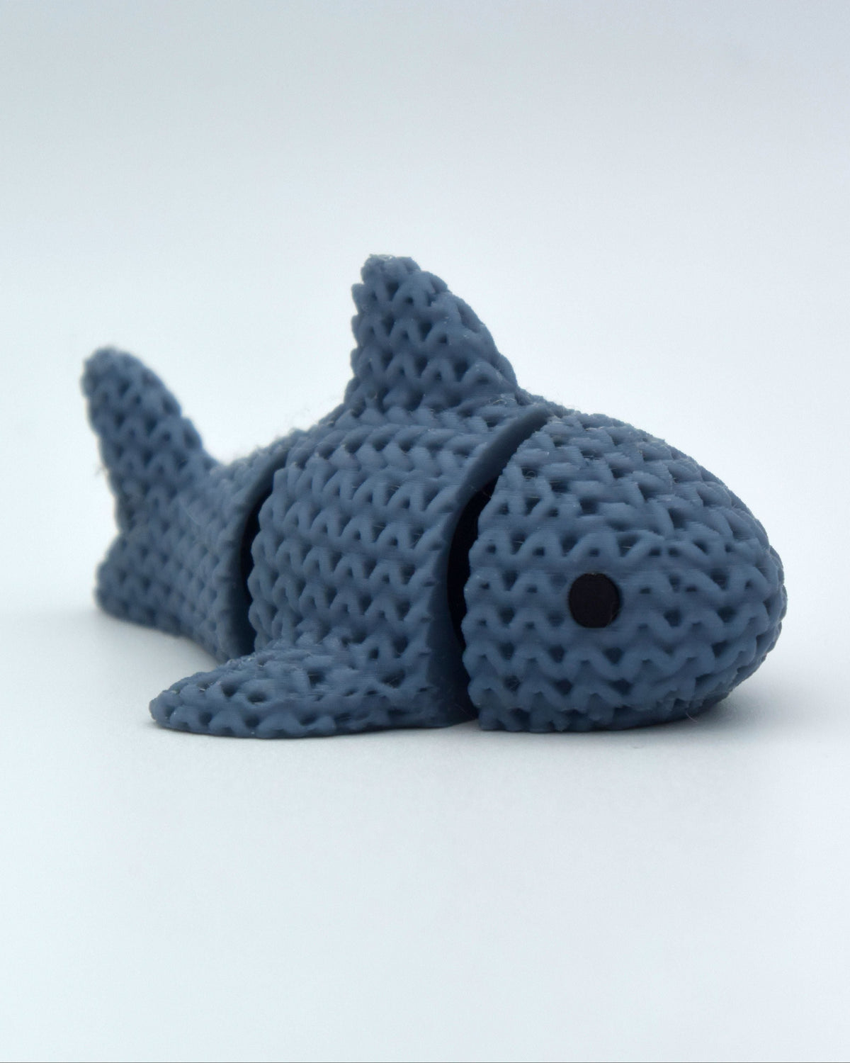 Détail de texture du requin façon tricot aux segments tissés le long du corps