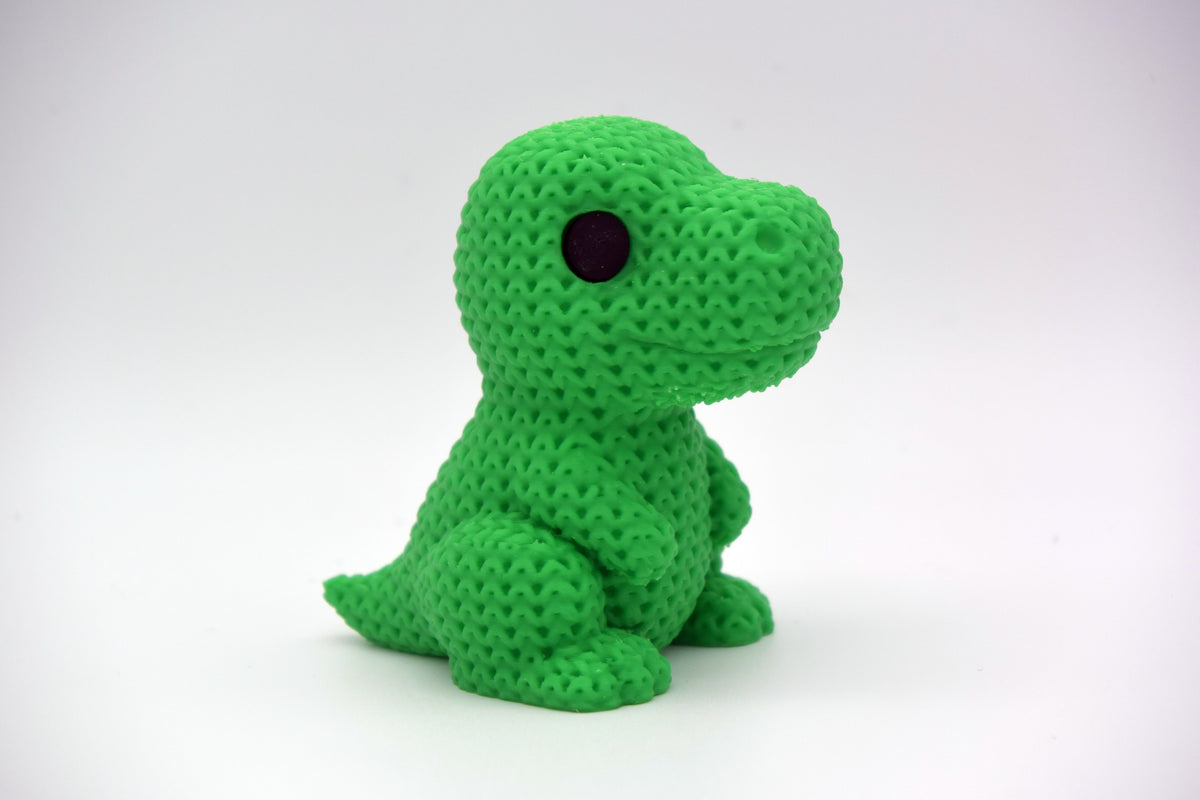 Détail de la texture crochetée d'une figurine de dinosaure T-Rex