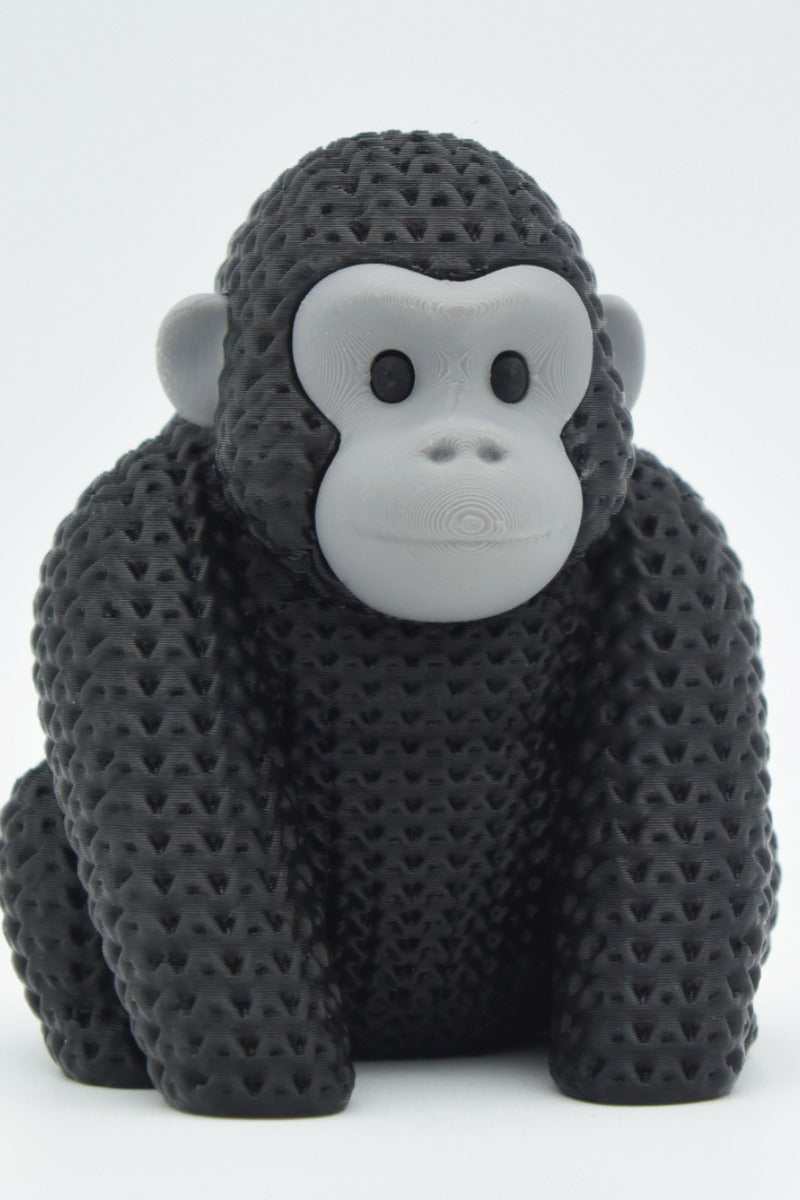 Gros plan d'une figurine de gorille tricoté à texture crochetée détaillée sur fond clair