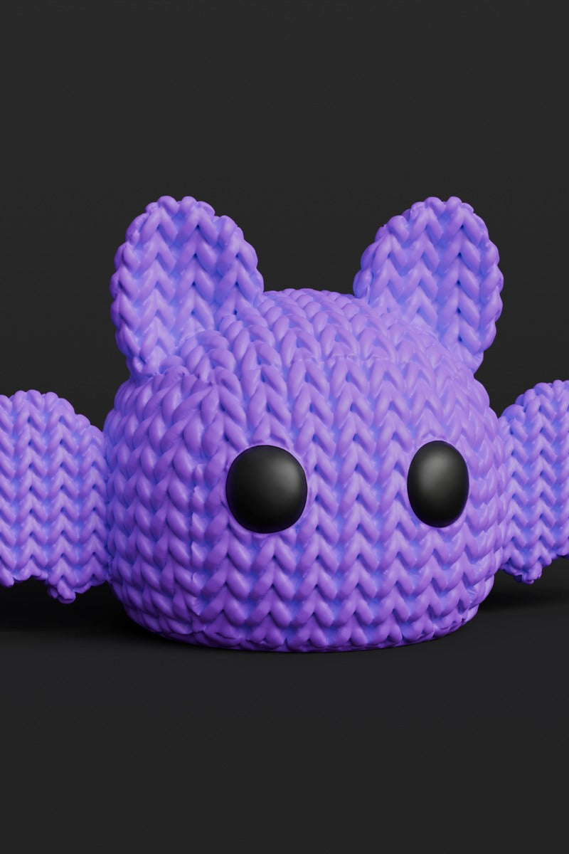 Gros plan d'une chauve-souris d'Halloween tricotée, aspect crocheté et petits yeux