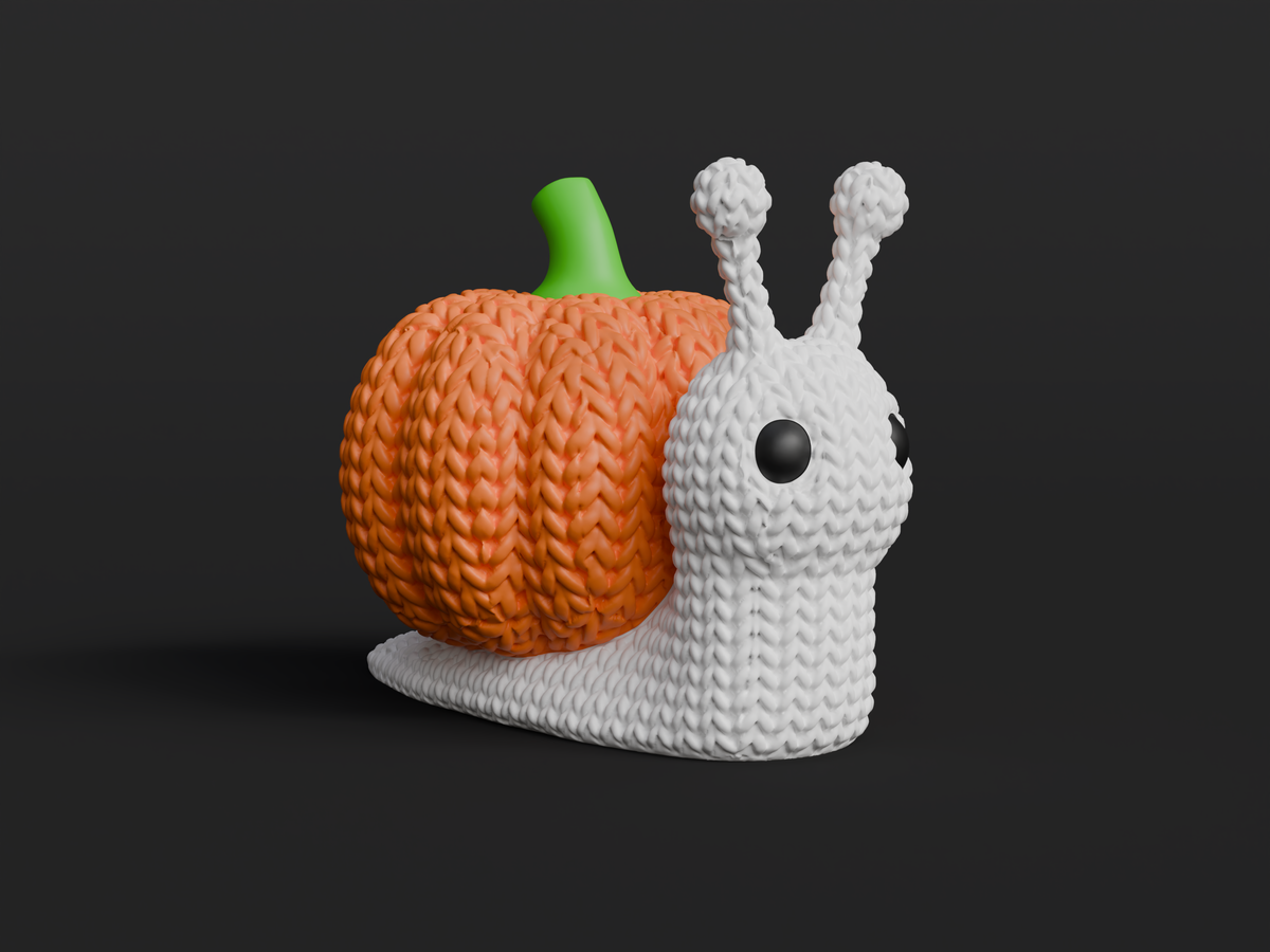 Gros plan d'un escargot-citrouille tricoté à la douce texture crochetée et à la coquille orange côtelée