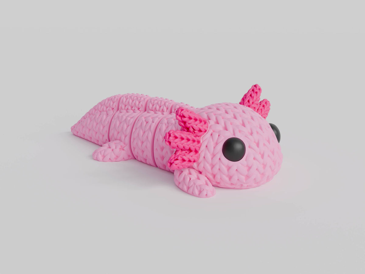 Gros plan d'une figurine d'axolotl tricoté rose à texture crochetée