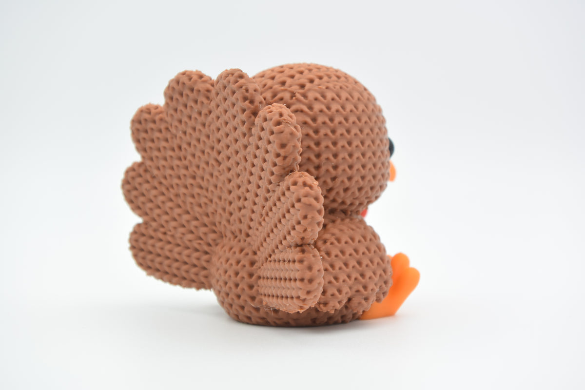Gros plan de la texture crochetée d'une décoration de dinde tricotée