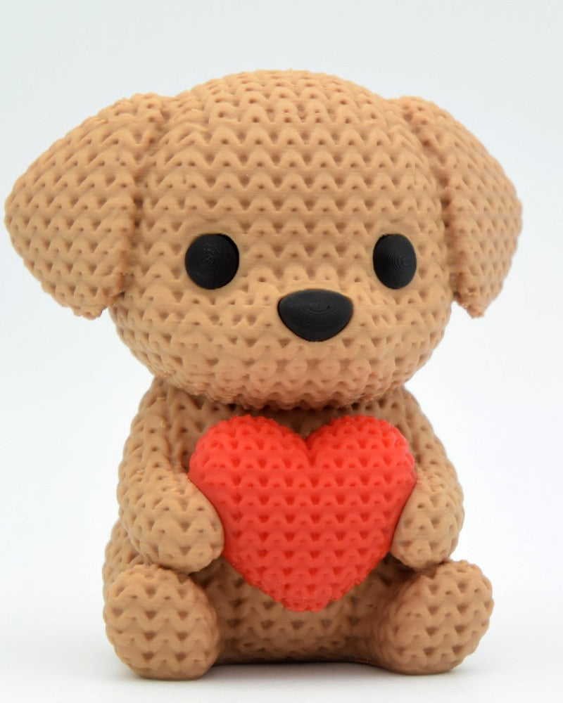 Gros plan d'une décoration chien crochetée avec un petit cœur et une douce texture de mailles