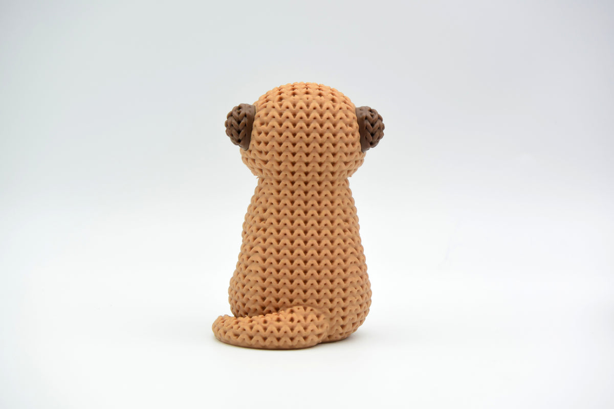 Détail de la texture crochetée et tissée d'une figurine décorative de suricate