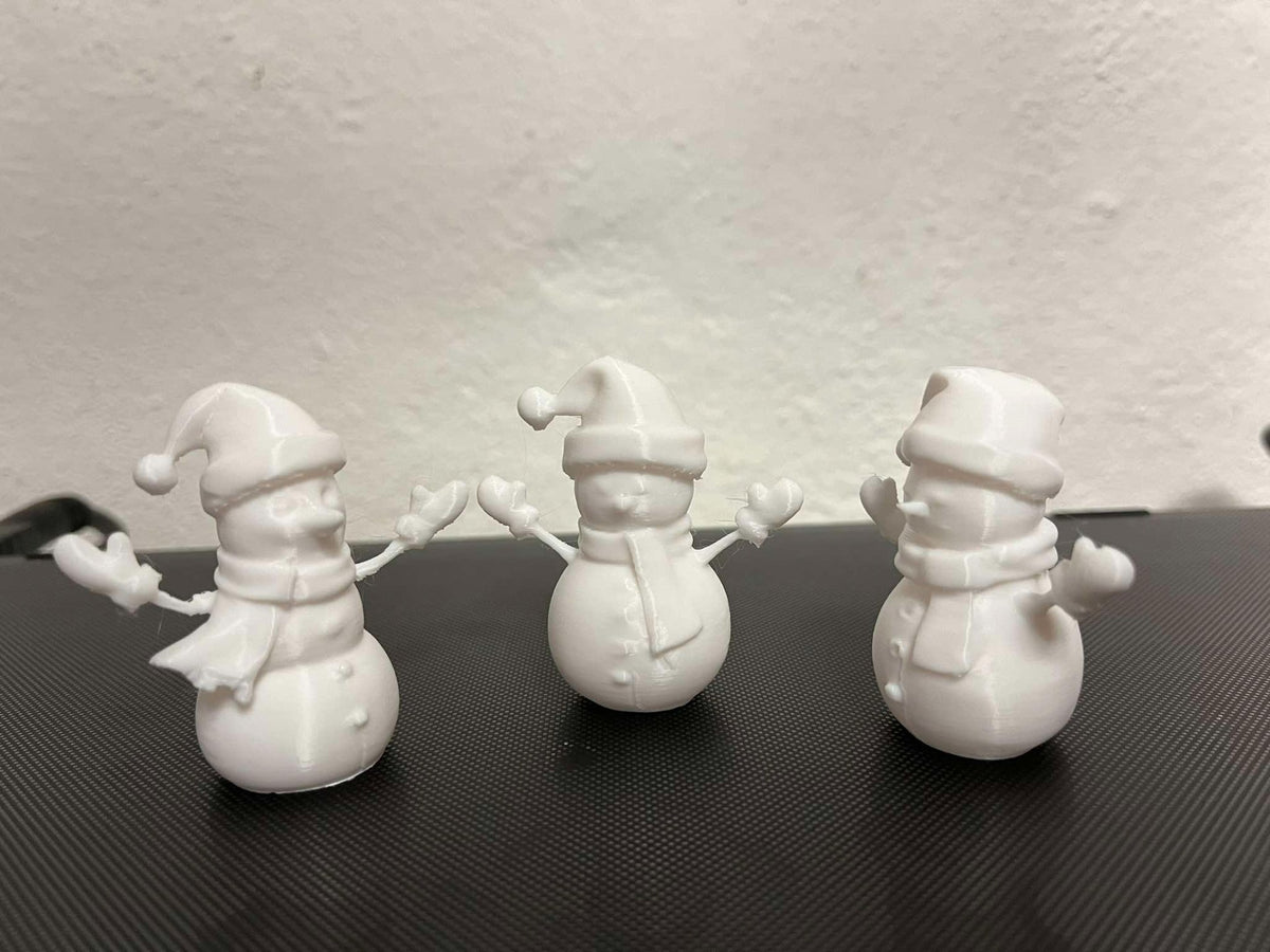 Figurine bonhomme de neige avec écharpe, gants et chapeau