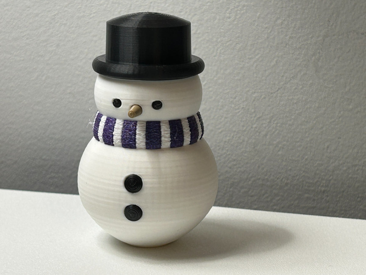 Figurine bonhomme de neige avec écharpe et haut-de-forme
