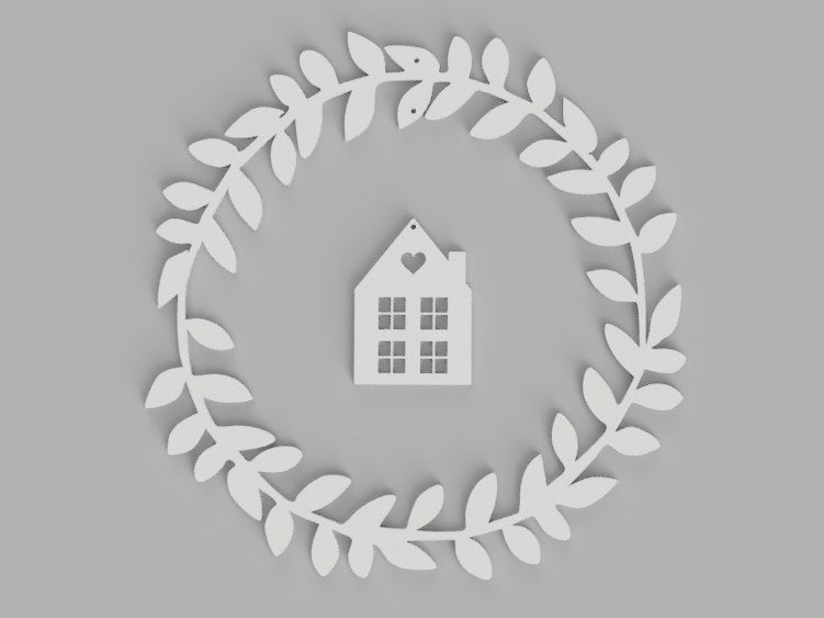 Couronne de fenêtre avec maison et cœur suspendus